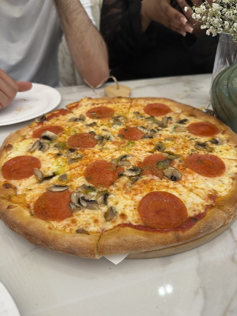 Pepperoni pizza fresh from the kitchen at Aura