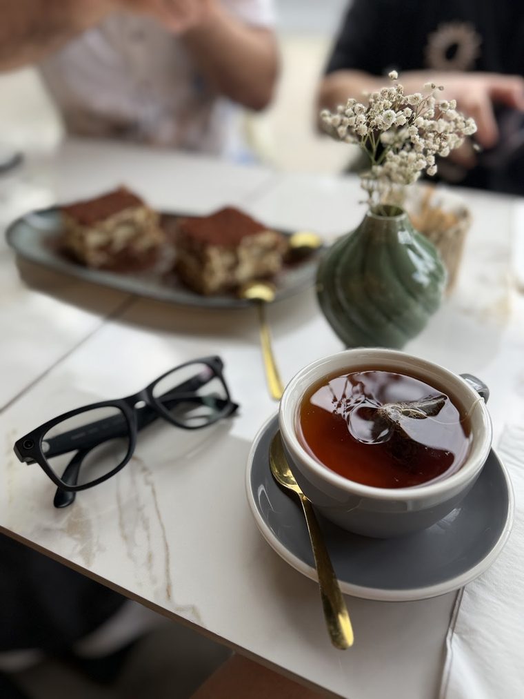 A pot of tea served with pastries